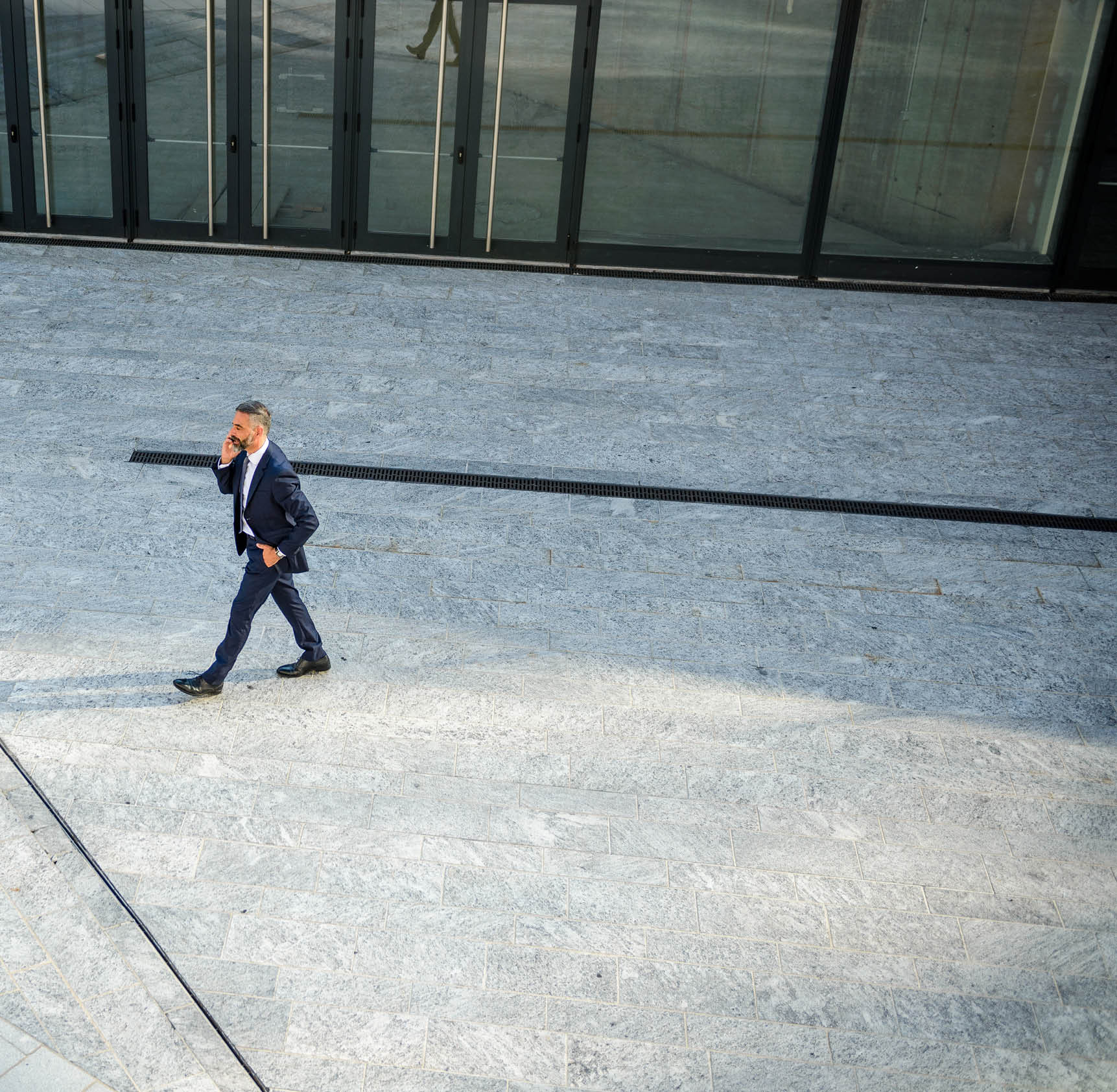 Overview of a businessman talking on the mobile phone