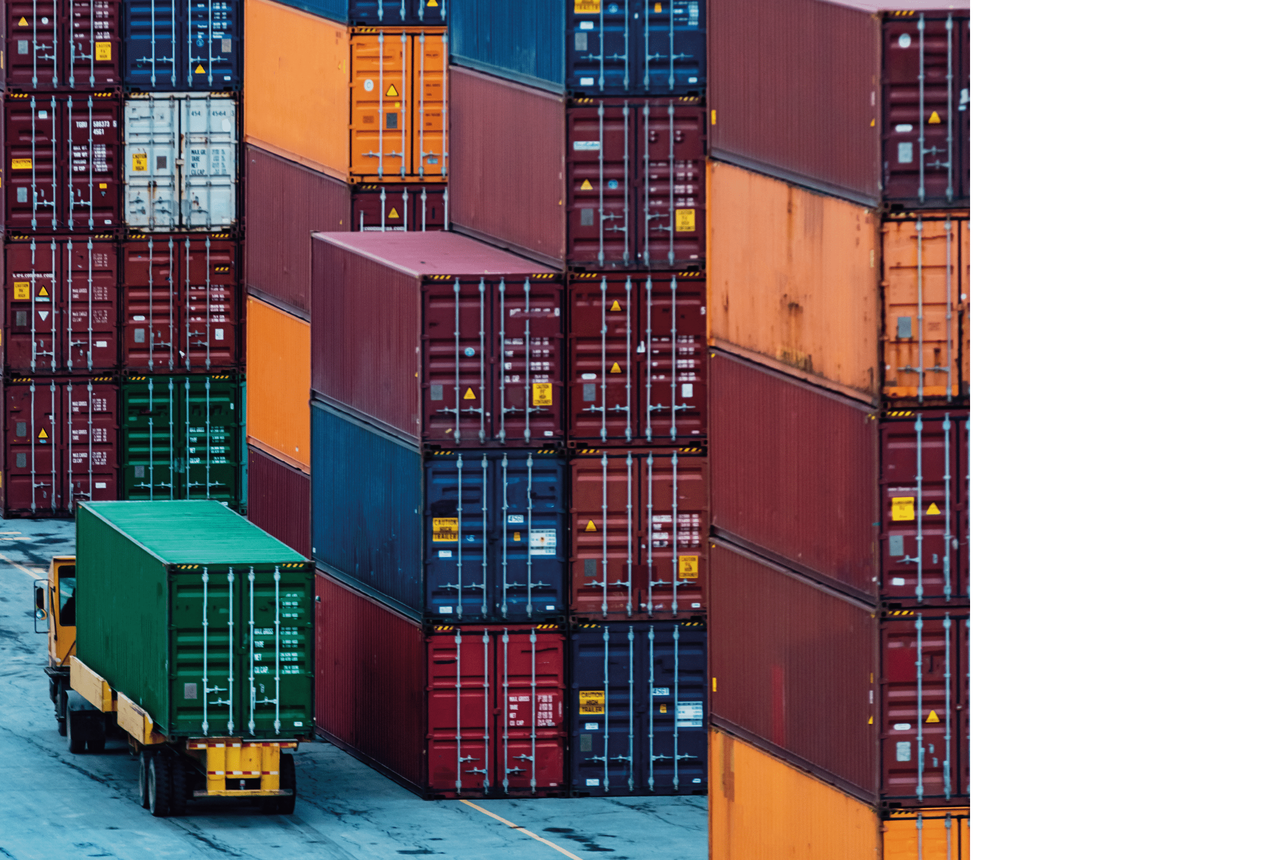 Shipping containers stacked high at a container pier.